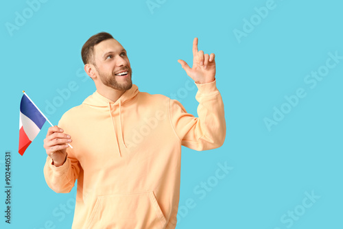 Young man with flag of Fran...