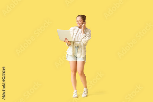 Young woman with modern lap...