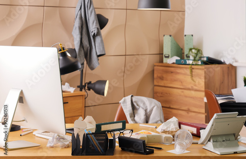 Messy workplace with garbag...