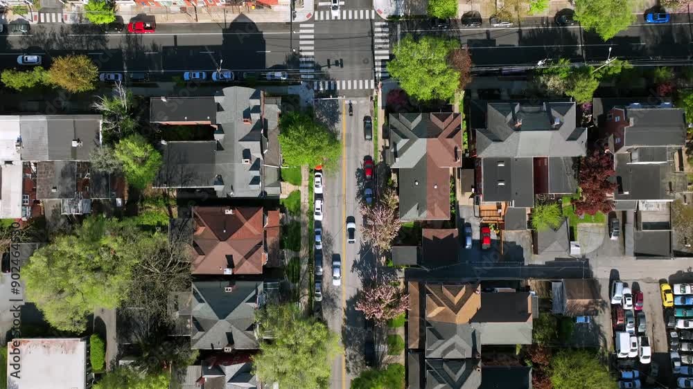 Aerial top down of junction in small american town with housing area. Driving Vehicle on road. Roof of homes during sunny day. Forward drone flight over classical rooftops. Aerial top down of junction in small american town with housing area. Driving Vehicle on road. Roof of homes during sunny day. Forward drone flight over classical rooftops.
