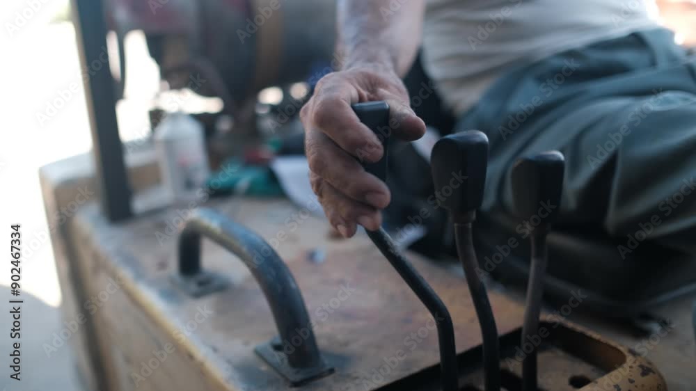 Close up of a man's hand pulling on a forklift handle Close up of a man's hand pulling on a forklift handle