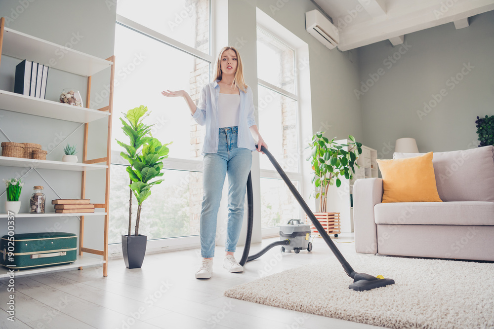 Photo of unhappy tired girl dressed casual shirt dislike vacuum cleaning home indoors house apartment room Photo of unhappy tired girl dressed casual shirt dislike vacuum cleaning home indoors house apartment room