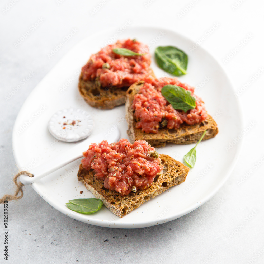 Traditional steak tartare on toast Traditional steak tartare on toast