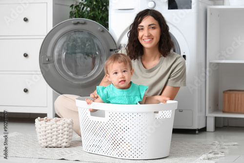 Young mother and her cute l...