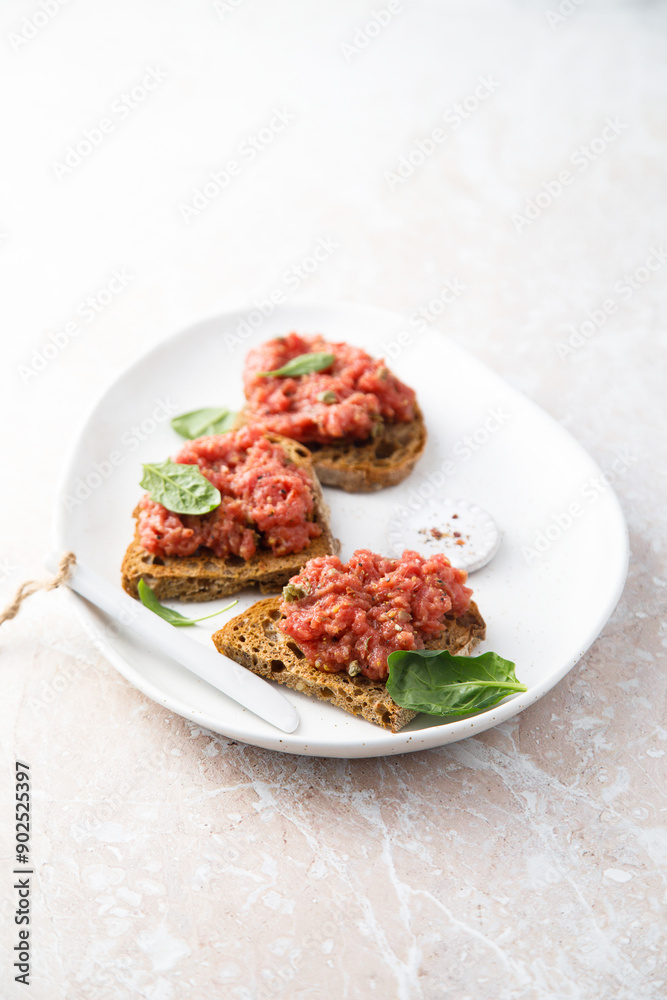 Traditional steak tartare on toast Traditional steak tartare on toast