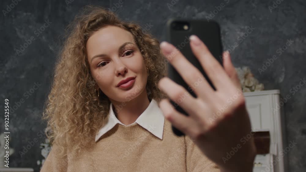 Woman Speaking on Video Call Using Smartphone Woman Speaking on Video Call Using Smartphone