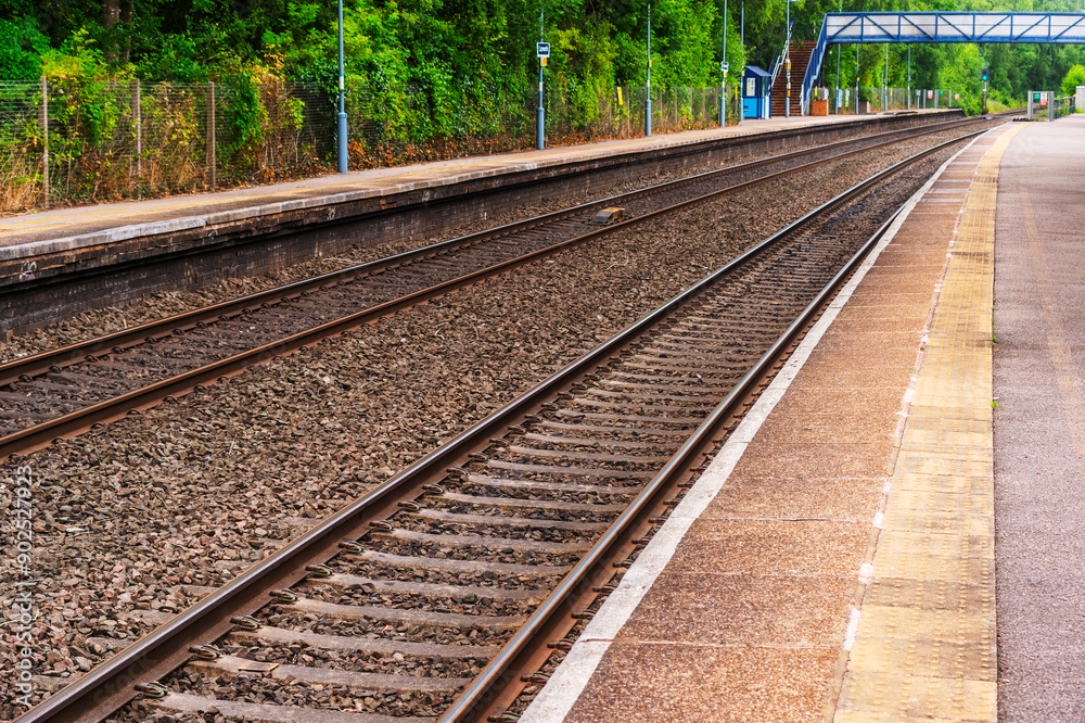 British rail train on tracks at station, England, UK British rail train on tracks at station, England, UK