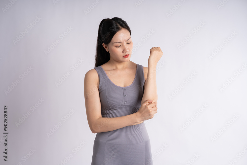 Portrait of Asian woman wearing sportswear, posing on white background Portrait of Asian woman wearing sportswear, posing on white background