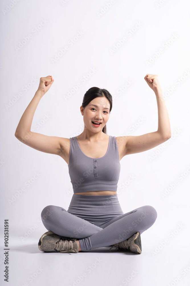 Portrait of Asian woman wearing sportswear, posing on white background. Portrait of Asian woman wearing sportswear, posing on white background.