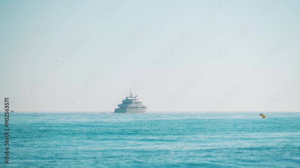 Luxury yacht on the Mediterranean Sea moving away from the coast Luxury yacht on the Mediterranean Sea moving away from the coast