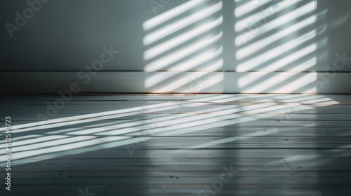 Photo showcasing sunlight breaking through window blinds and casting elongated shadows, forming beautiful patterns over a wooden floor, creating a rustic and serene atmosphere. photo