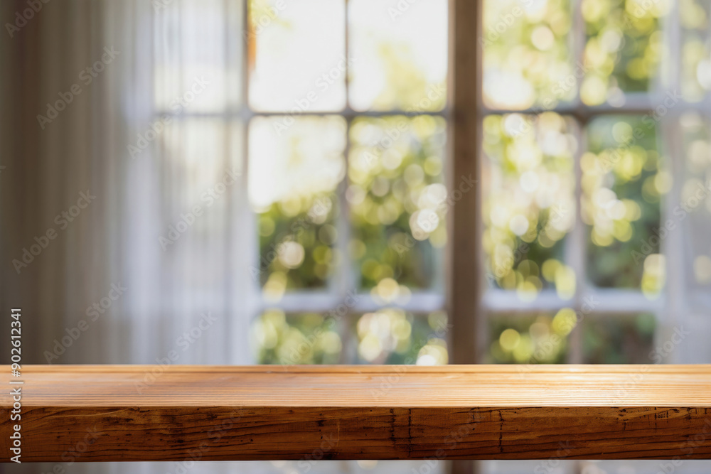 Empty wooden tabletop with blurred window and nature background, perfect for product placement Empty wooden tabletop with blurred window and nature background, perfect for product placement