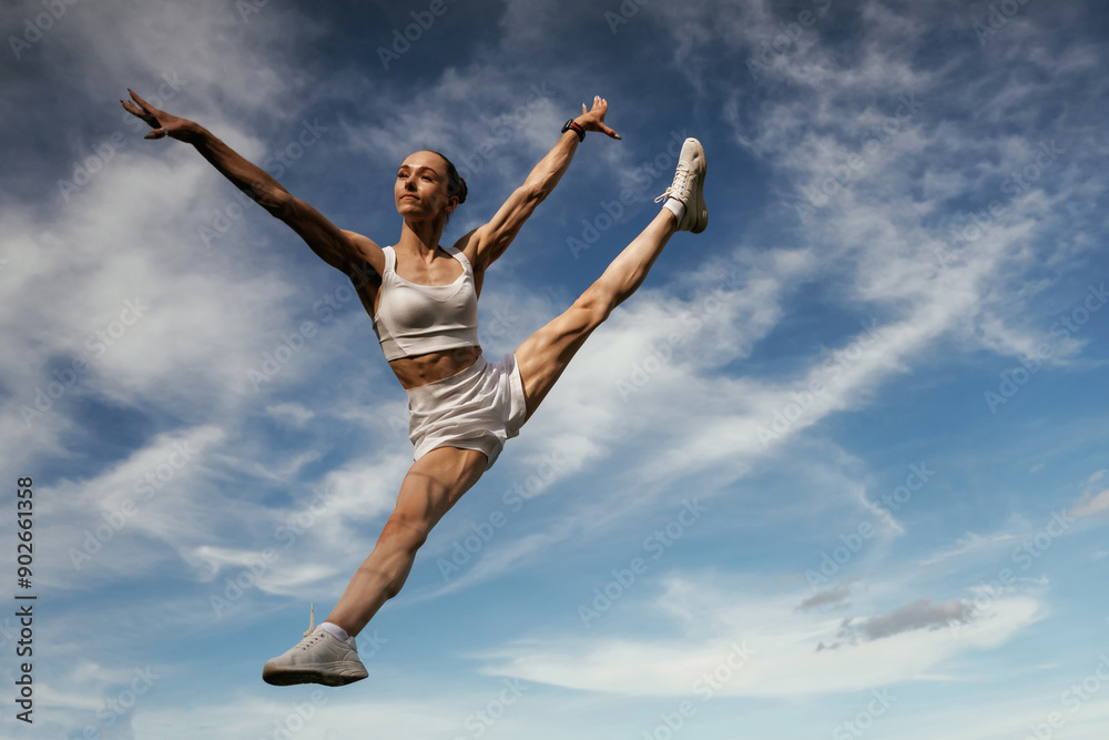 Freedom conception, against the sky. Young skinny fitness woman is outdoors Freedom conception, against the sky. Young skinny fitness woman is outdoors
