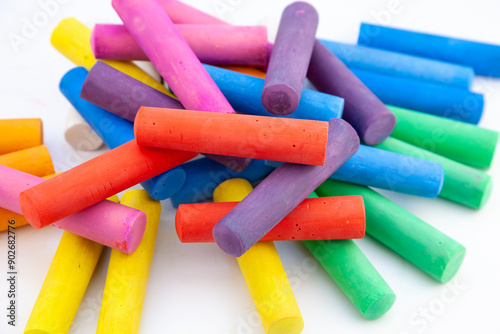 Set of colorful chalks for the board and the street. Drawing chalk stick, back to school background. Heap draw equipment. Childhood