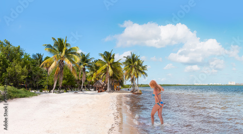 Fototapeta Naklejka Na Ścianę i Meble -  Paradise Sunny beach with palms and turquoise sea. Summer vacation and tropical beach concept - Cancun, Mexico