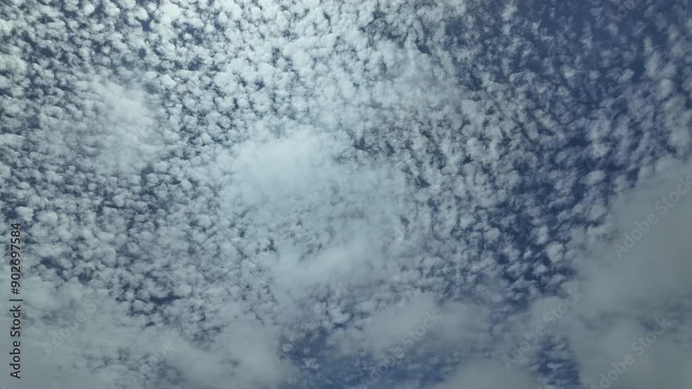 Glorious ever-changing sky dotted with high cirrus clouds and an airplane crossing the scene from right to left climbing. Timelapse. 4K Glorious ever-changing sky dotted with high cirrus clouds and an airplane crossing the scene from right to left climbing. Timelapse. 4K