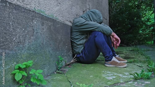 Fenantyl Drug Addict Junkie under Influence of Psychoactive Substance Narcotic Sitting in Dangerous Shabby Neighbourhood Alley