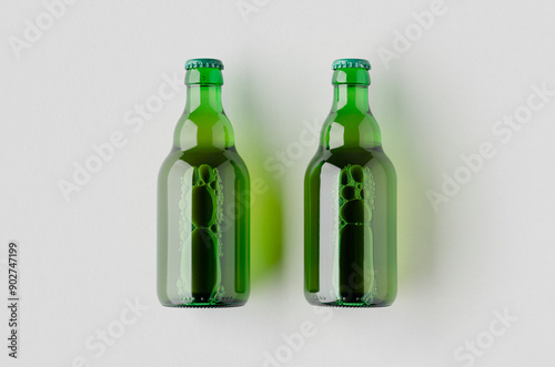 Green steinie beer bottle mockup on a grey background.