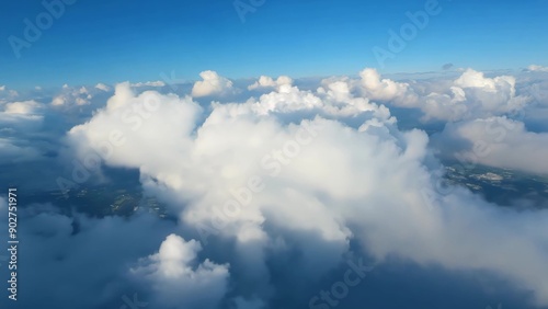 Fluffy white clouds in a bright blue