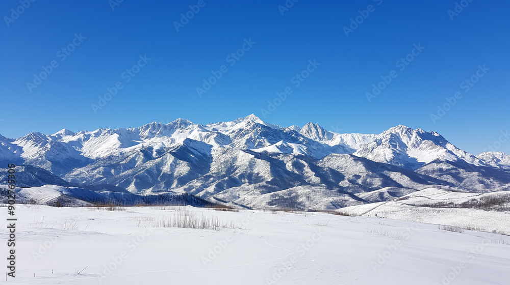View of Snow-Covered Caucasus Mountains under Clear Blue Sky View of Snow-Covered Caucasus Mountains under Clear Blue Sky