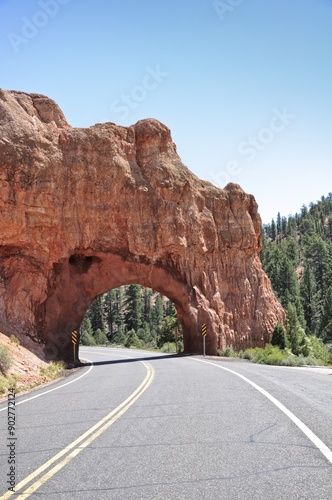 tunnel road through stone arche in red canyon UT-12