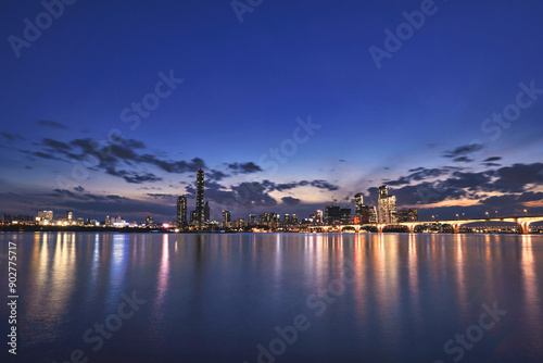 Night view of 63 Building and high rise buildings of financial district with Wonhyo Bridge on Han River at Yeouido near Yeongdeungpo-gu, Seoul, South Korea
 photo