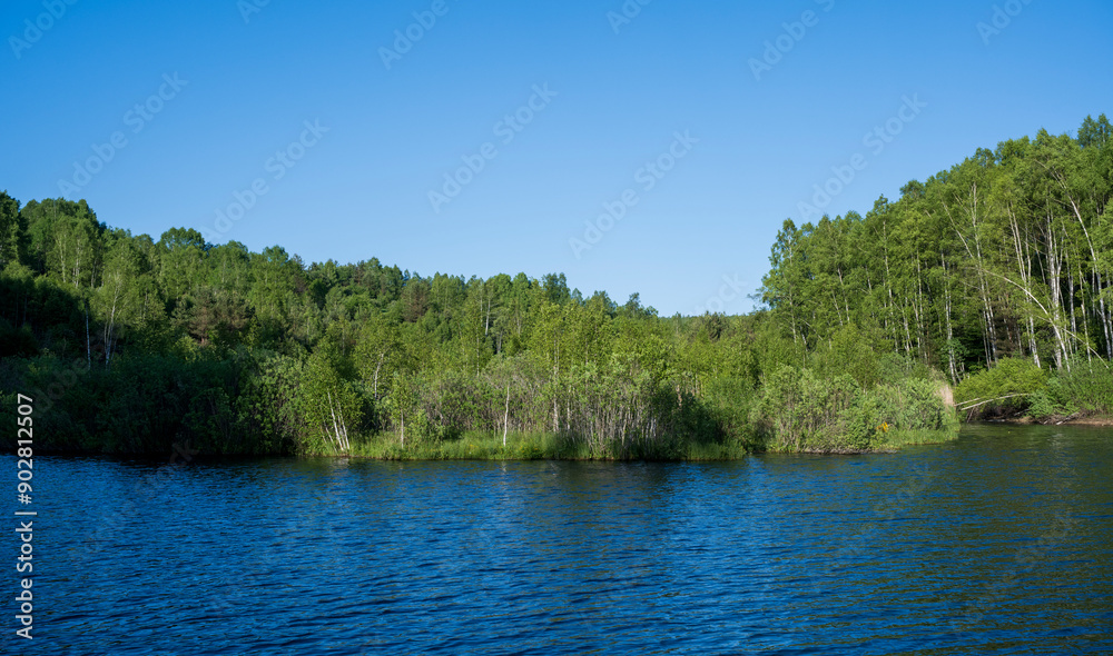 Vlasina lake scenery with beautiful clouds in the blue sky. Beautiful semi-artificial lake in Southeast Serbia. The beautiful blue color of the water. Vlasina lake scenery with beautiful clouds in the blue sky. Beautiful semi-artificial lake in Southeast Serbia. The beautiful blue color of the water.