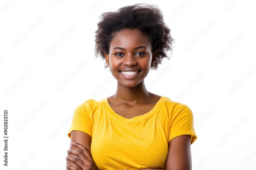 A happy woman in a yellow shirt smiling directly at the camera A happy woman in a yellow shirt smiling directly at the camera