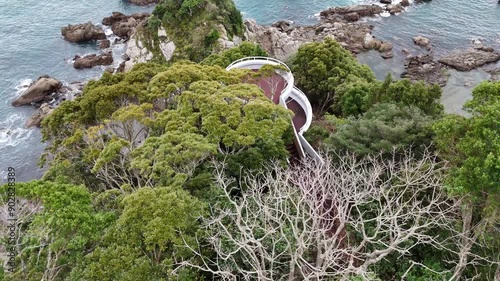 日本の風景 青い海と岬の上にある展望台をドローンで空撮 鹿児島県志布志市の風景