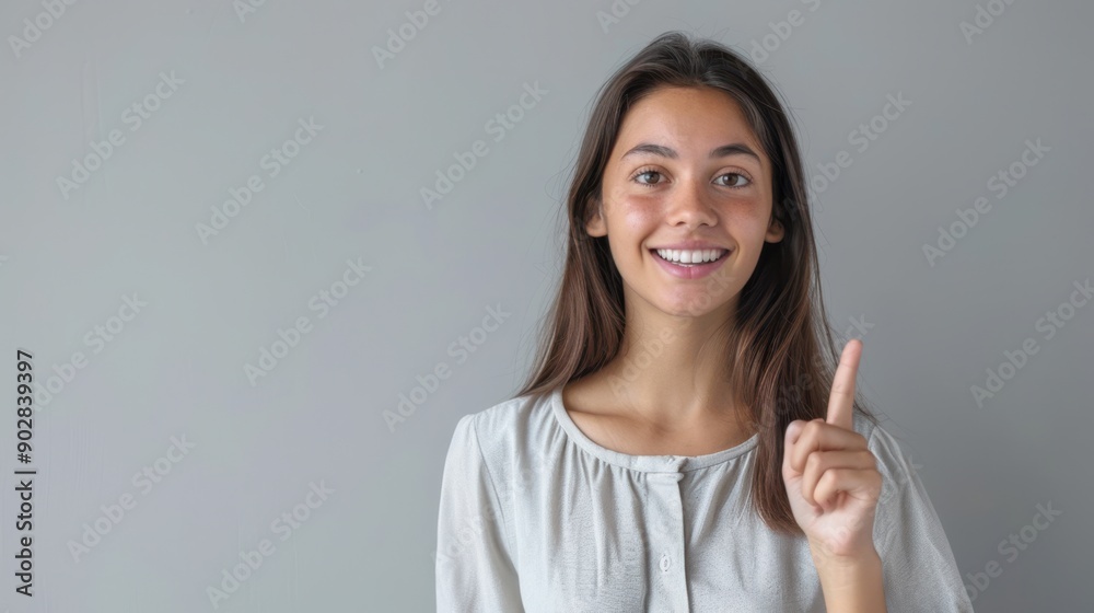 The smiling woman pointing The smiling woman pointing