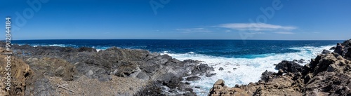 Impressive photograph of Cape Favaritx. Captures the iconic lighthouse on a rocky cliff with the Mediterranean Sea in the background. Menorca, Spain photo