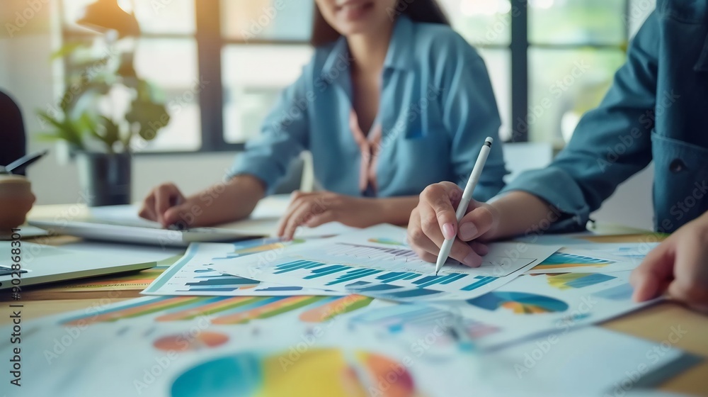 Business People Analyzing Data and Charts Business People Analyzing Data and Charts
