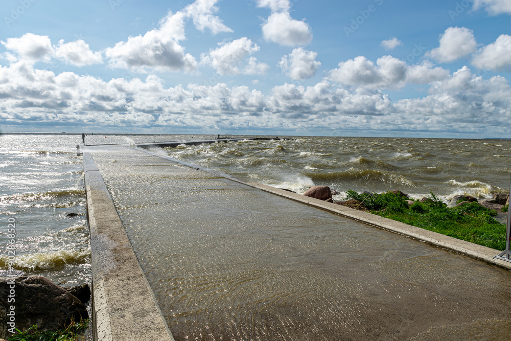 seascape, sea during a storm, splashing waves on the jetty, fast moving clouds seascape, sea during a storm, splashing waves on the jetty, fast moving clouds