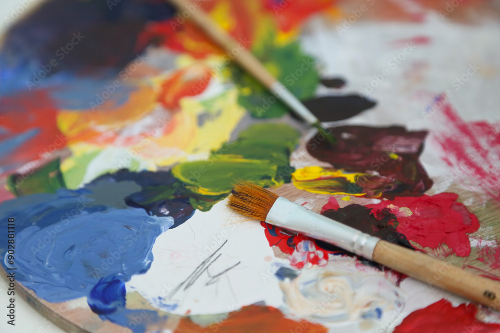 paint brushes on a palette paint brushes on a palette
