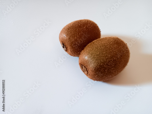 Ripe juicy Kiwi fruits aka Actinidia deliciosa isolated on white background. photo