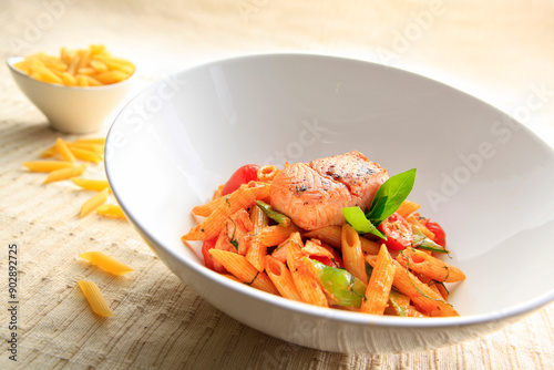 Tasty pasta with smoked salmon on a bowl