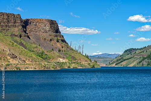 Basalt cliffs abut the reservoir at the Anderson Ranch Dam near Mountain Home in Idaho, USA