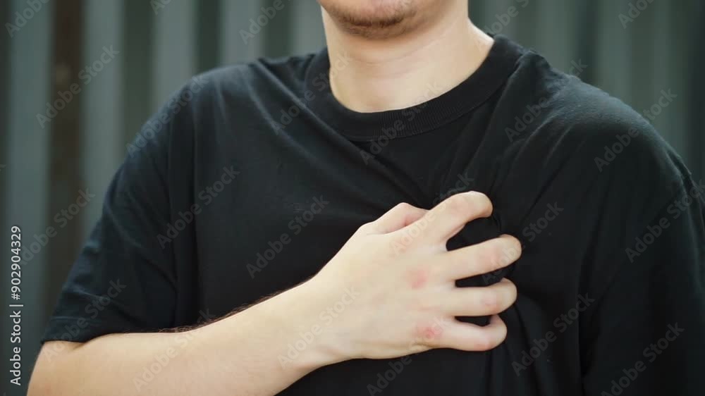 a person suffers from heart failure.
Hand holding heart.
Chest pain in a man