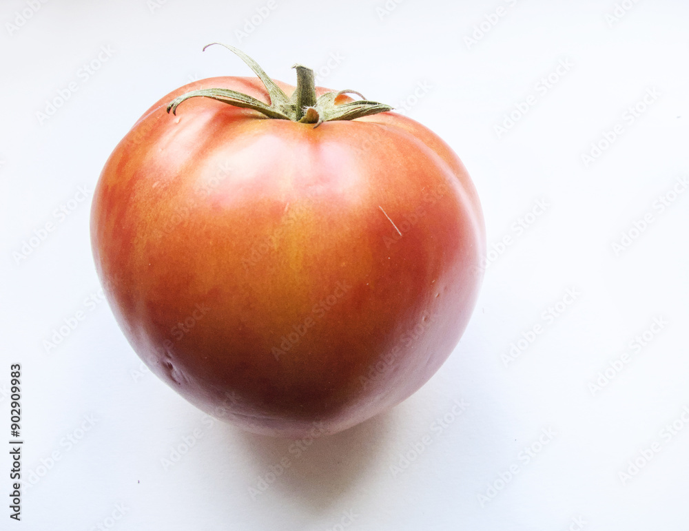 Red sharp big tomato isolated on white background Red sharp big tomato isolated on white background