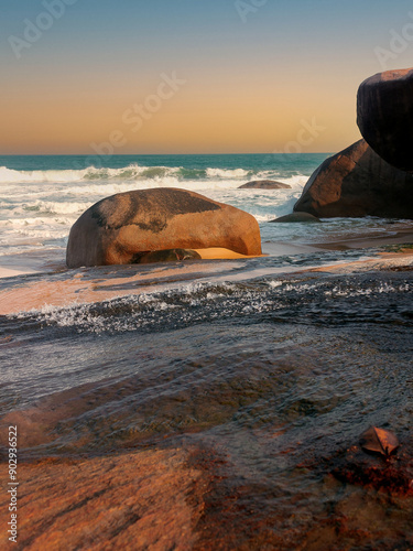 A serene beach landscape with gentle waves under a clear sky
