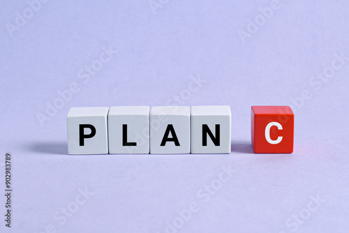 Plan c test on white red wooden cubes on the blue background. business concept