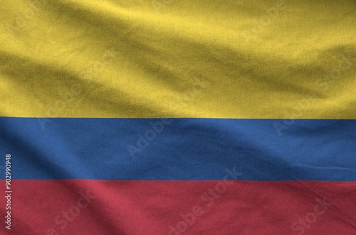 Colombia flag depicted on folded wavy fabric of old cloth close up photo