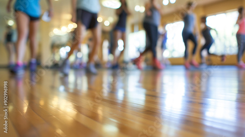 Fitness Class with Blurred Participants on Wooden Floor