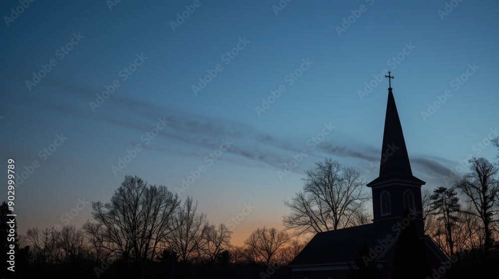 Peaceful evening scene with a church steeple silhouetted by the last light of the day. Peaceful evening scene with a church steeple silhouetted by the last light of the day.