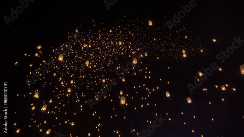 Thai people release sky floating lanterns or lamp to worship Buddha's relics at night. Traditional festival in Chiang mai, Thailand. Loy krathong