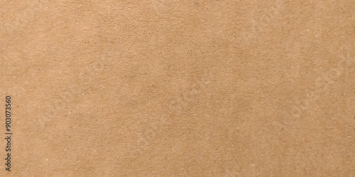Background of brown kraft paper or cardboard texture. Abstract pattern of beige rough carton, old paper sheet, parchment or papyrus surface. High quality texture in extremely high resolution