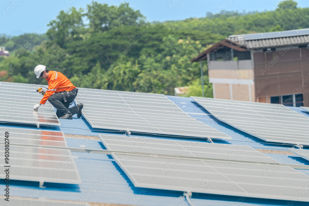 Worker Technicians are working to construct solar panels system on roof. Installing solar photovoltaic panel system. Men technicians walking on roof structure to check photovoltaic solar modules. Worker Technicians are working to construct solar panels system on roof. Installing solar photovoltaic panel system. Men technicians walking on roof structure to check photovoltaic solar modules.