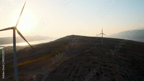 Modern wind turbines rotate generating clean energy on Pag Island. Innovative solution provides cost-effectiveness of wind energy in Croatia