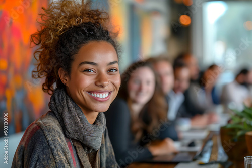 Smiling young woman in a casual meeting. A compelling image for expressing positivity and teamwork in professional and personal settings. Ideal for marketing and editorial use