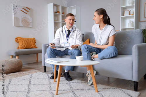 Male doctor listening to il...